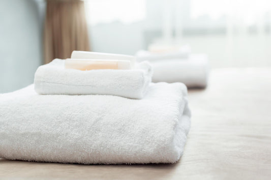 White towels and washcloths in a hotel room
